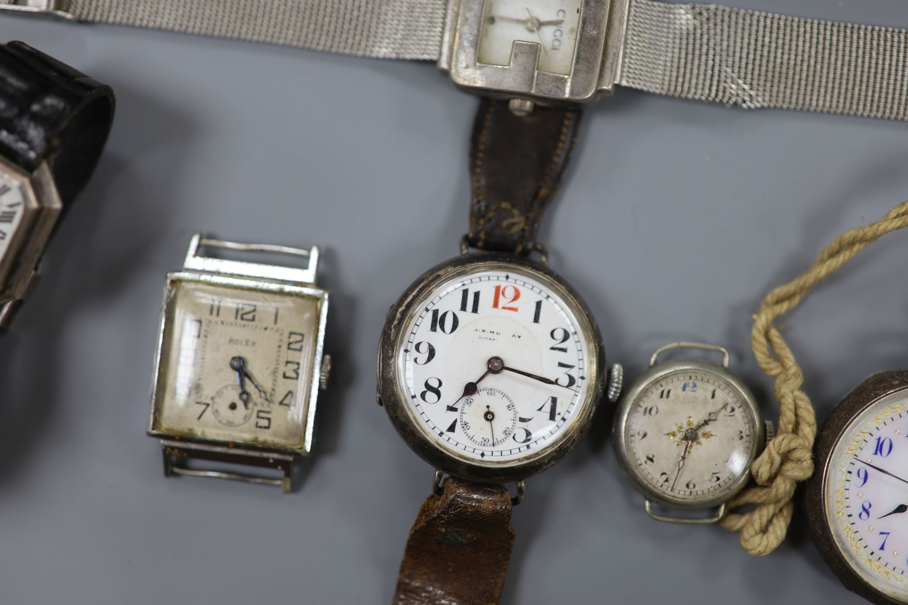 A gentleman's early 20th century silver trench wrist watch by J.W. Benson, four other wrist watches, two silver or white metal fob watches and a wrist watch case.